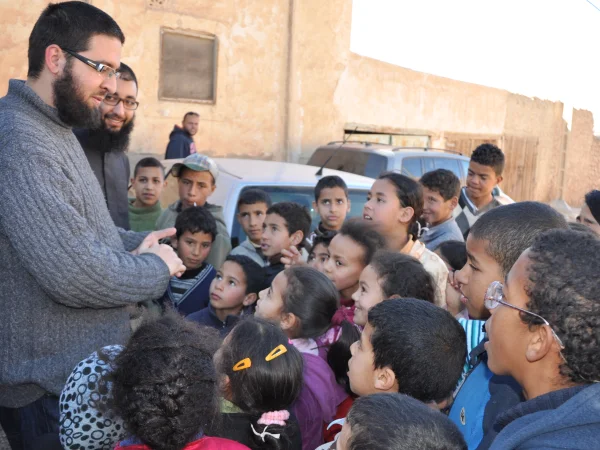 Surrounded by kids in Itzer village