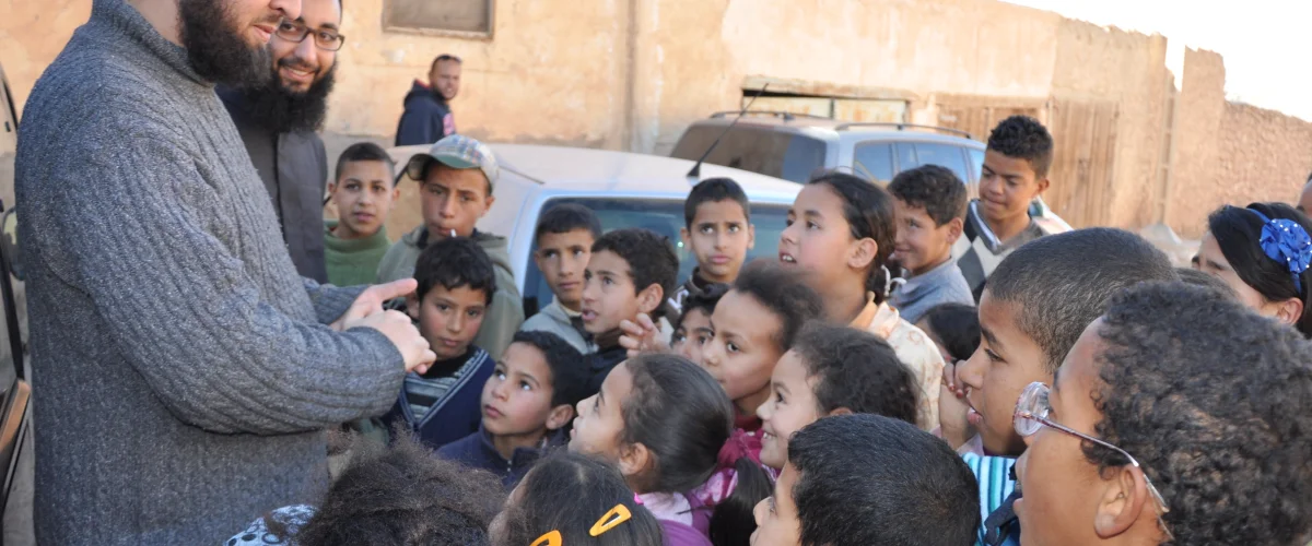 Surrounded by kids in Itzer village