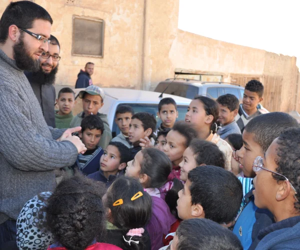 Surrounded by kids in Itzer village